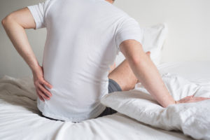 can a chiropractic adjustment help with lower back stiffness 